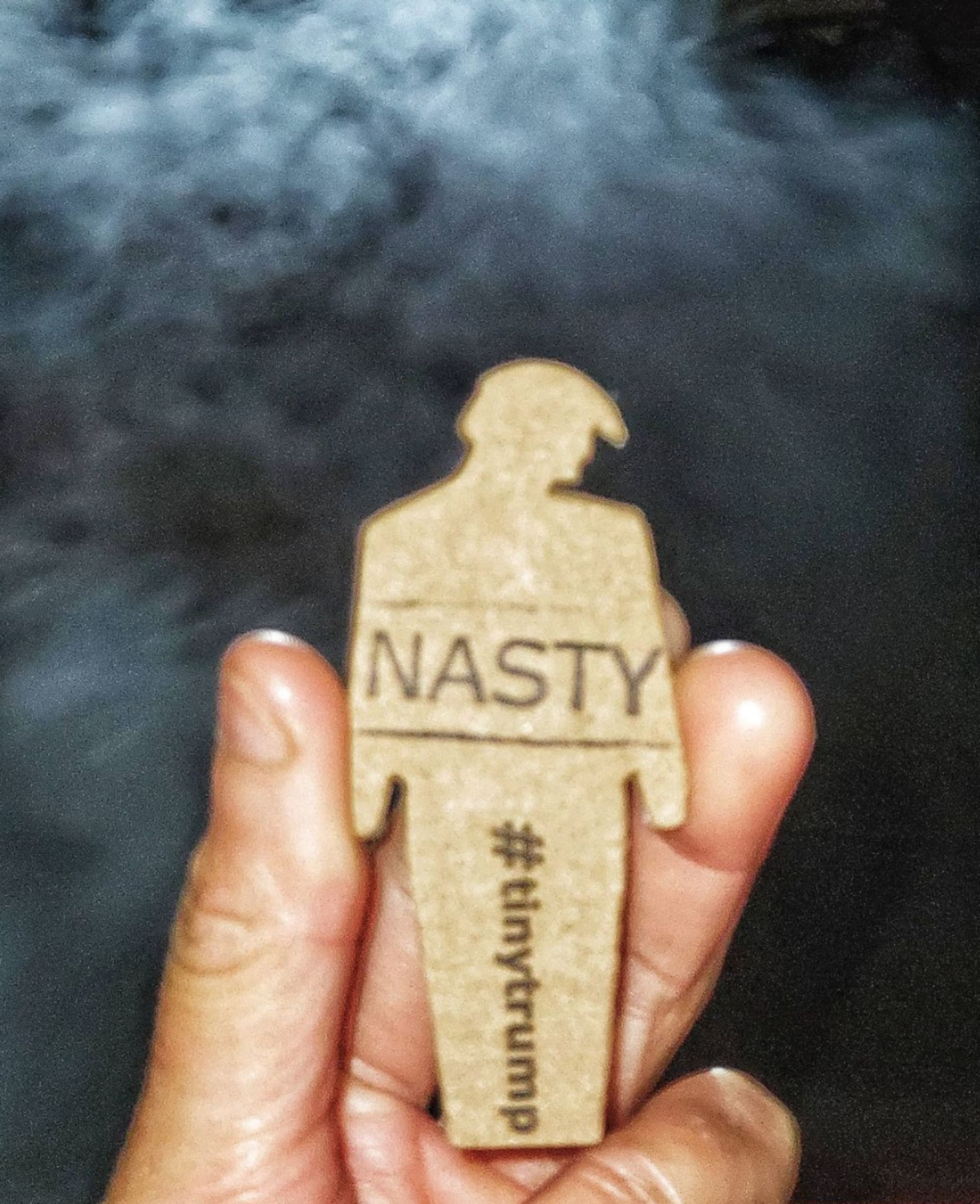 Photograph of a ‘DIY' with a custom stamp that a participant made that says Nasty